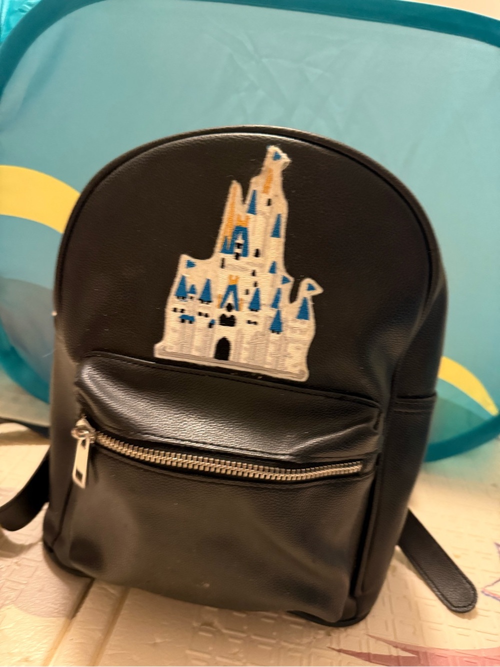 Black Mini Backpack with Blue Castle Patch